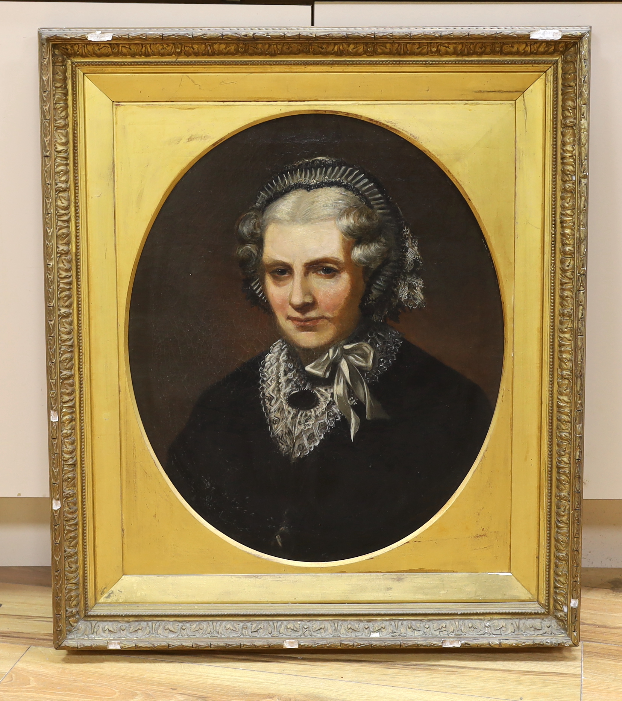 Victorian School, oval oil on canvas, Portrait of an elderly lady wearing mourning dress, 57 x 47cm